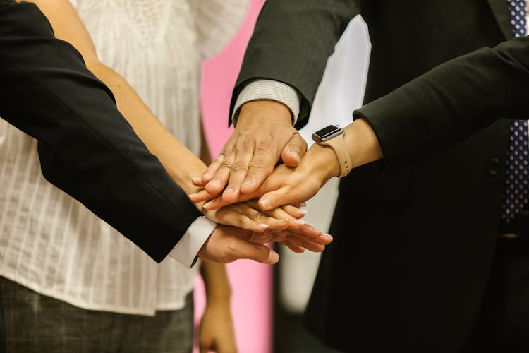 Workmates In A Team Huddle