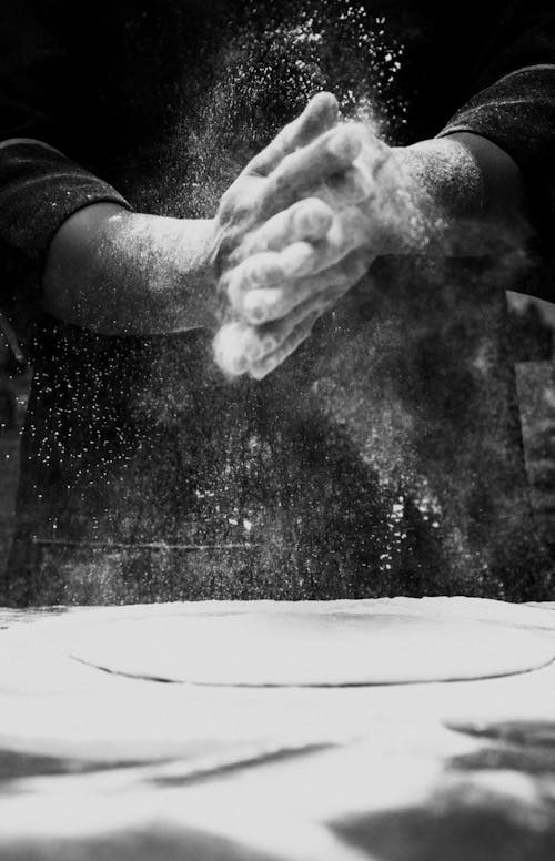 Free Person Spreading Flour Stock Photo