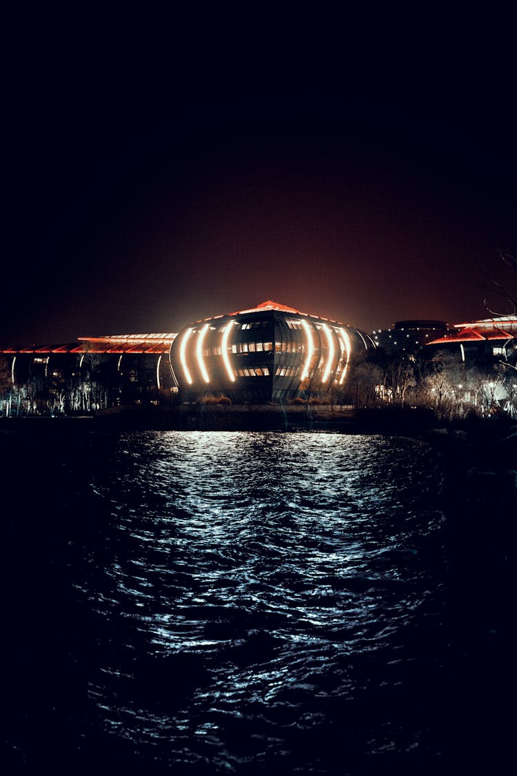 Lighted Building Under Dark Sky