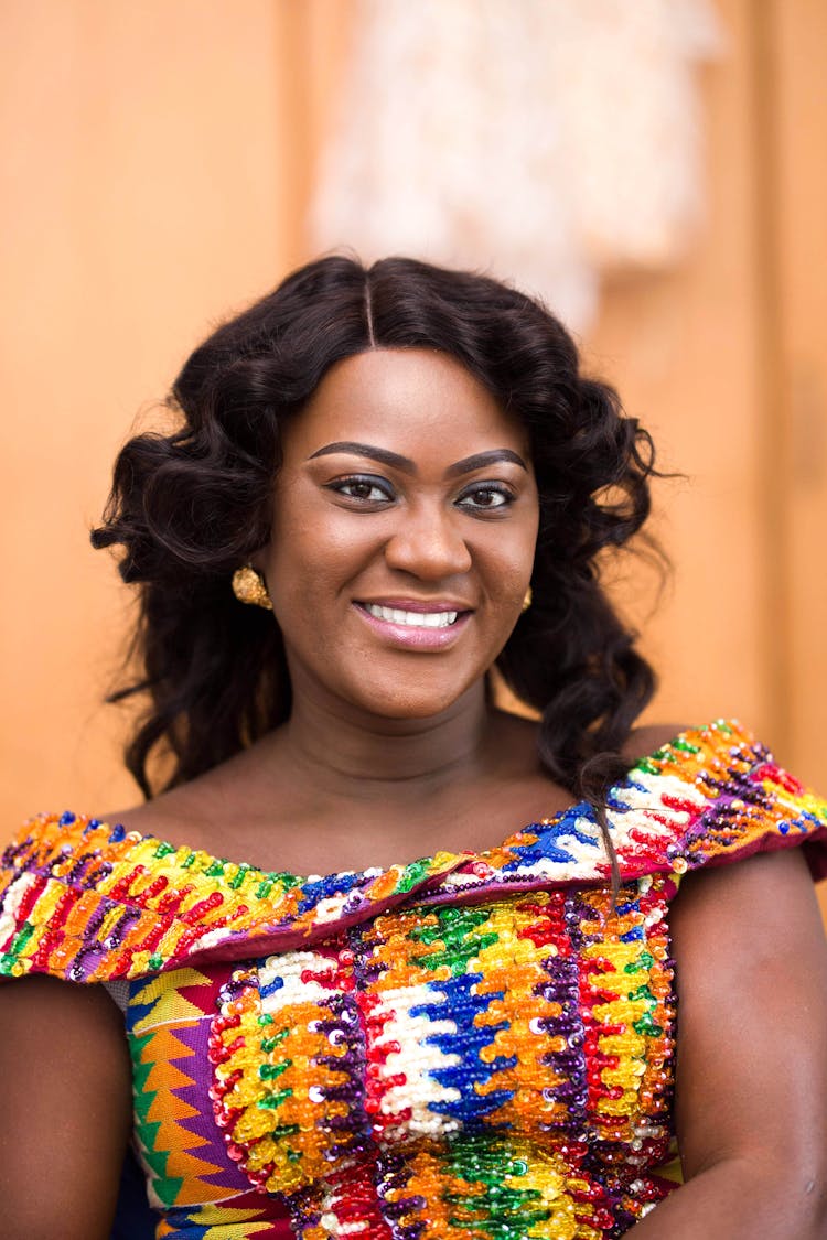 Woman In Colorful Off Shoulder Smiling