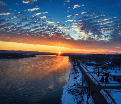 Aerial view of a vibrant winter sunrise over the Mississippi River in Wabasha, Minnesota.