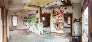 Abandoned building with graffiti on walls