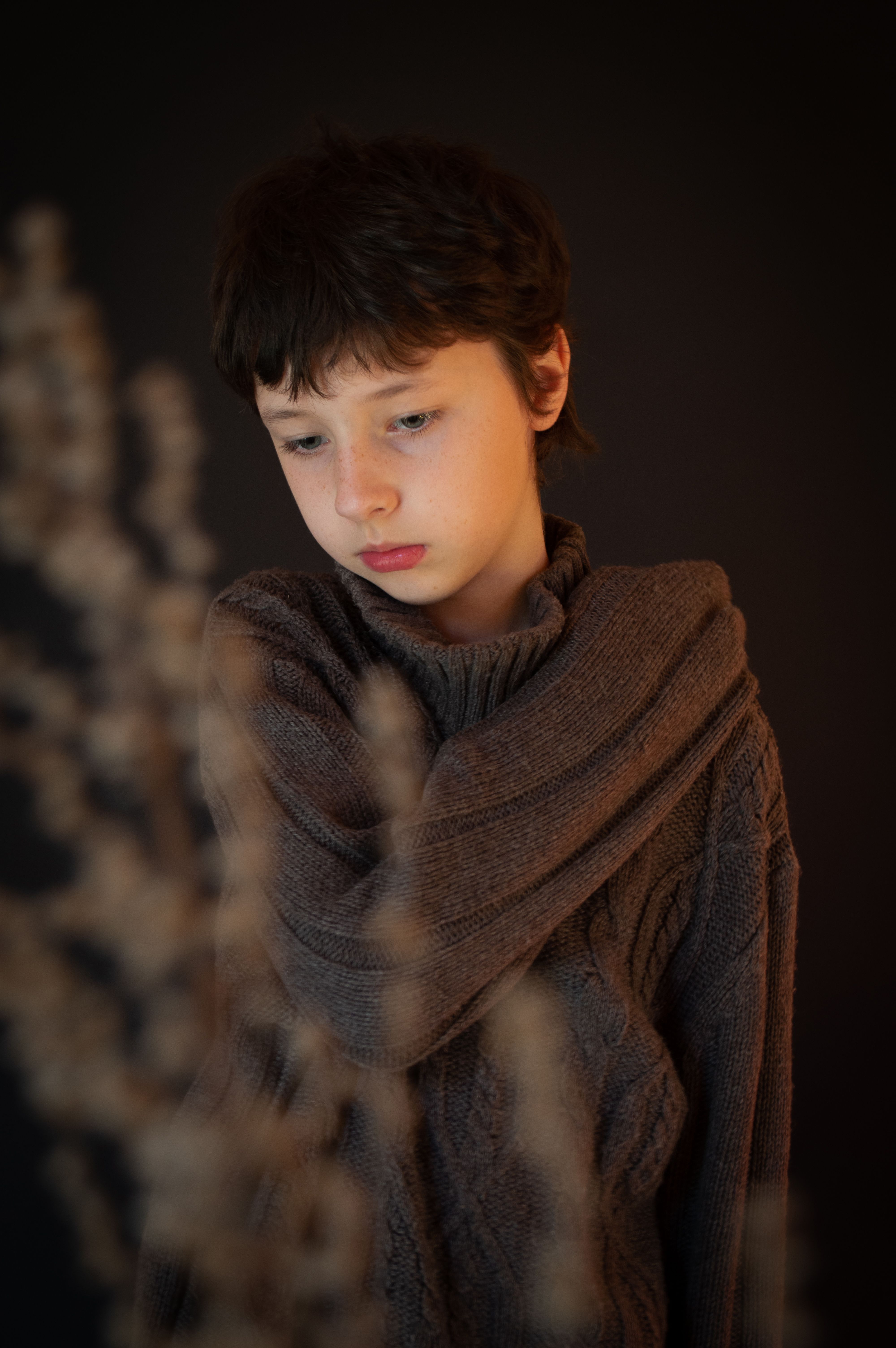 A Young Boy Wearing Black Knitted Sweater · Free Stock Photo