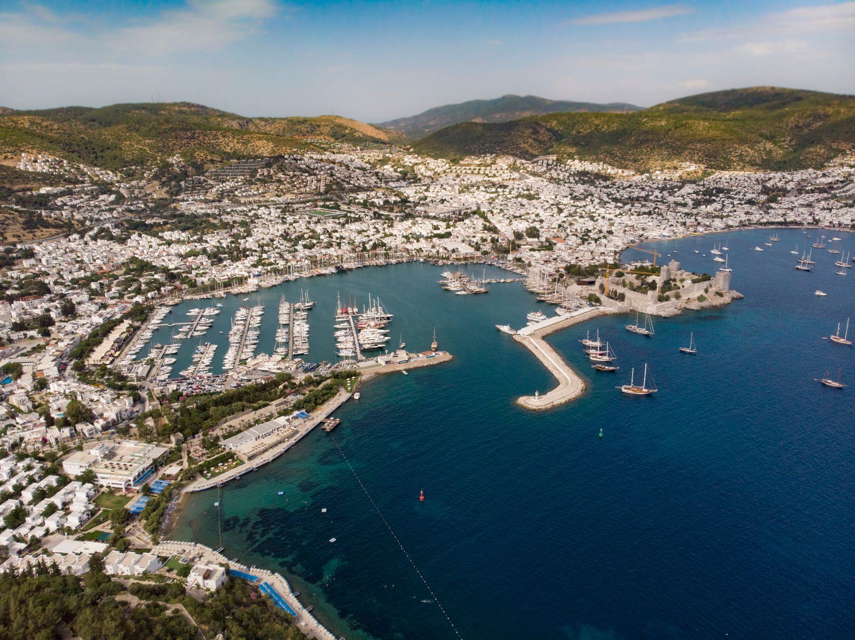 Aerial photograph showcasing Bodrum harbor's vibrant marina and surrounding landscape.