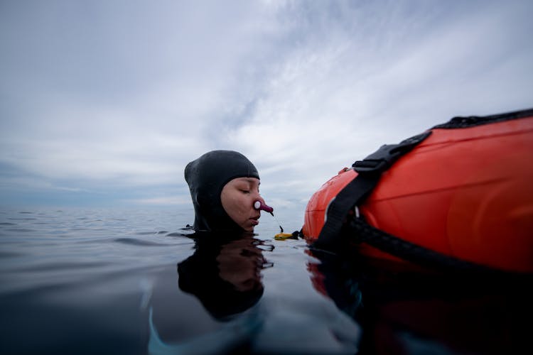 Person In Water With Nose Clips