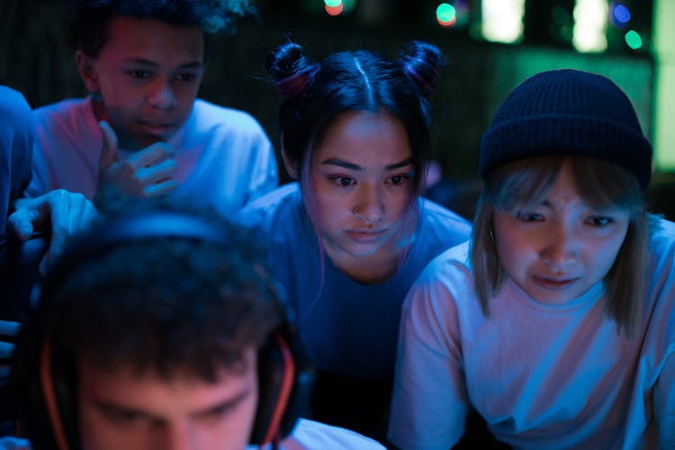 Young People Looking At The Monitor