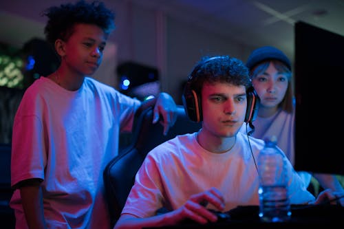A Man with Black Headphones Playing Video Games