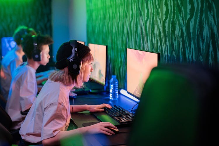 People Gaming In An Internet Cafe