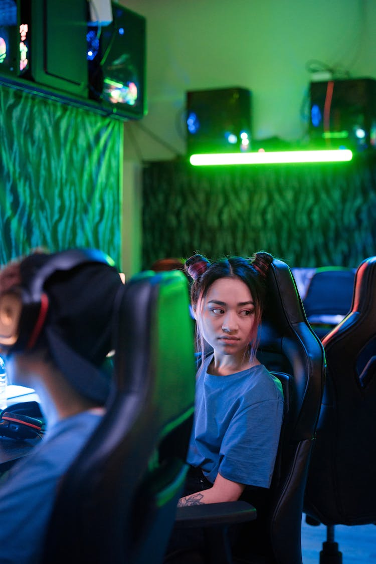A Young Woman Sitting In A Gaming Chair