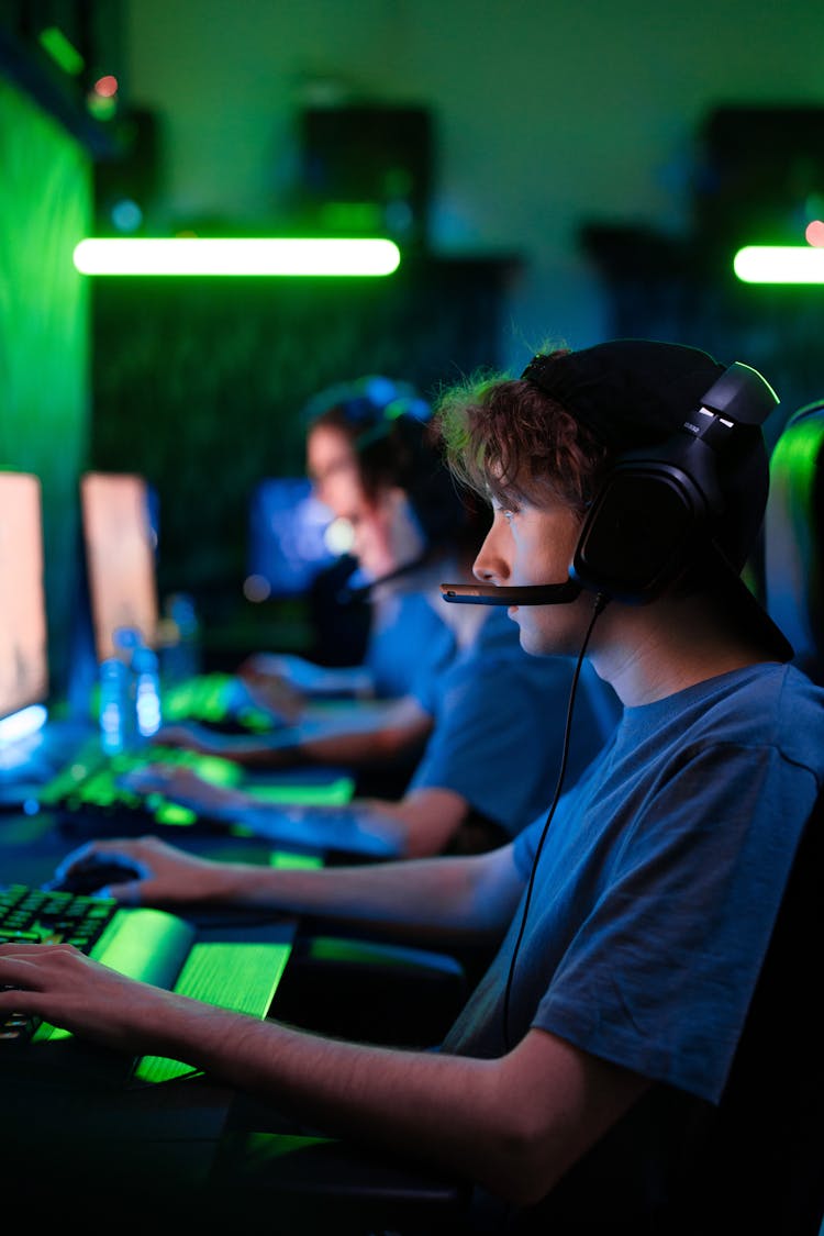 Man With Black Headphones Playing Computer Games