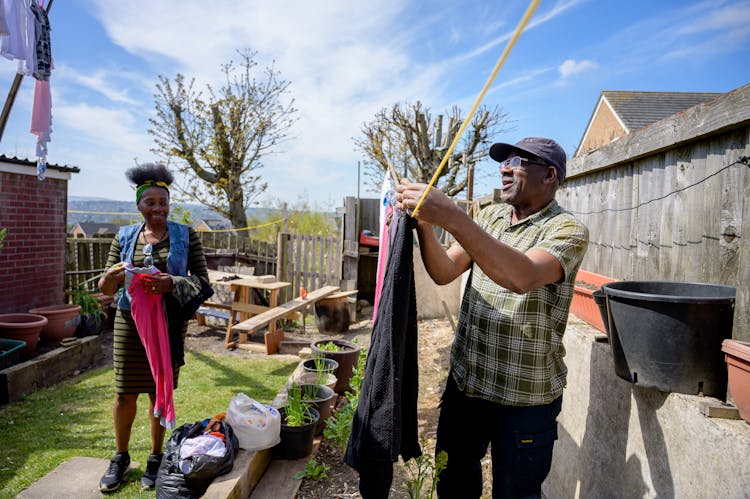 Man And Woman Working In Backyard