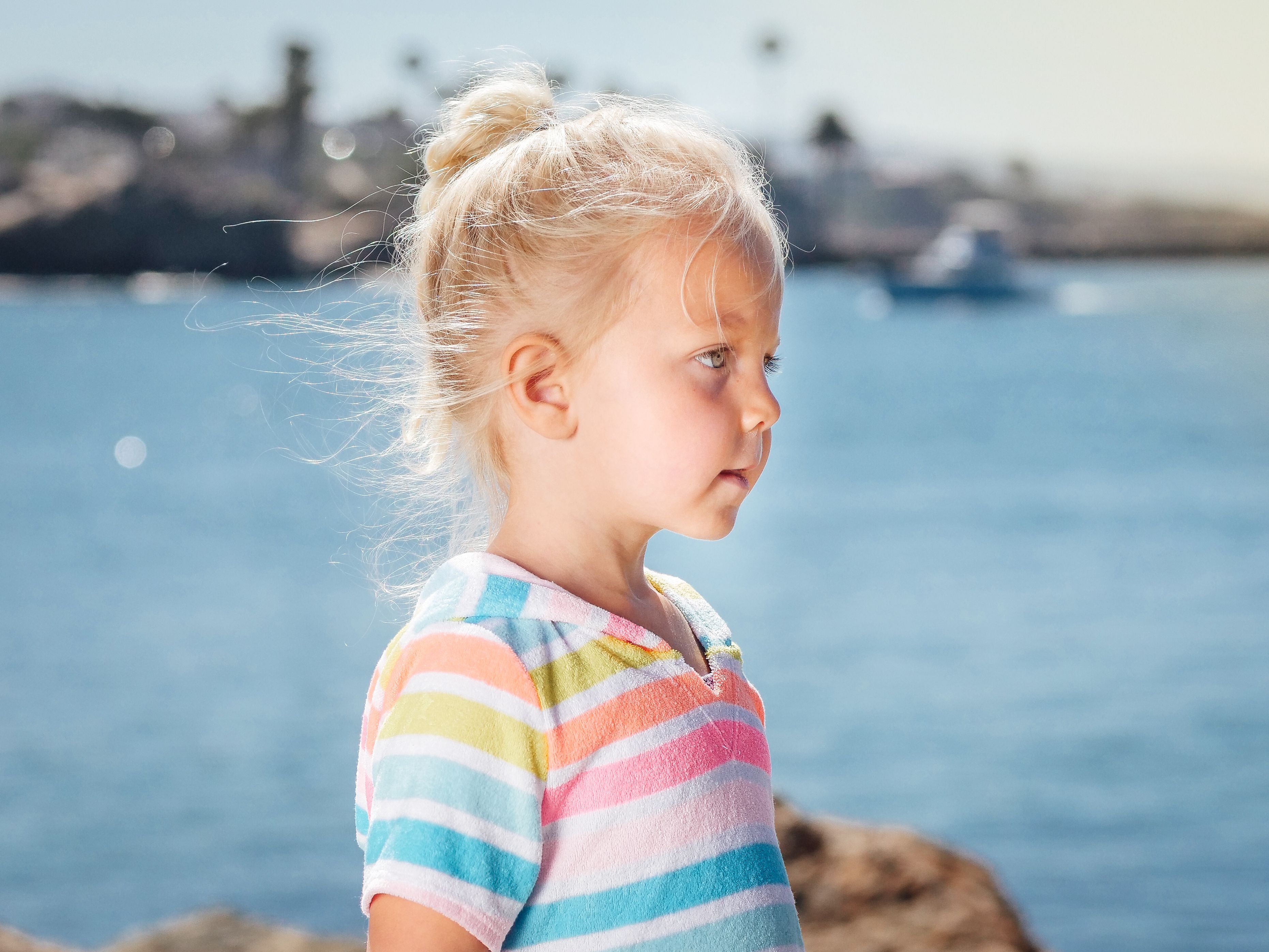 A Young Girl Standing Beside the Beach · Free Stock Photo