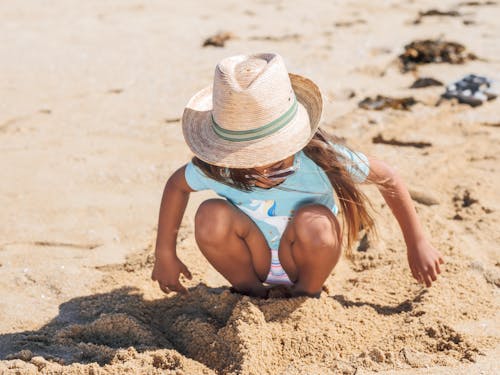 Free Girl Playing with Sand Stock Photo