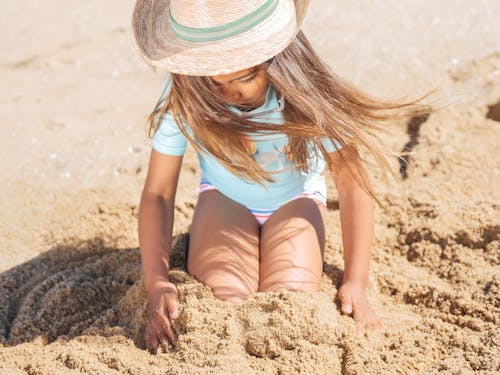 Girl Playing on Sand