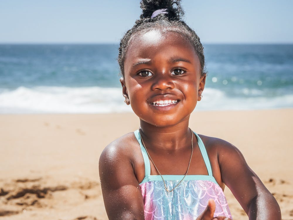 A Little Girl Wearing a Swimsuit on the Beach