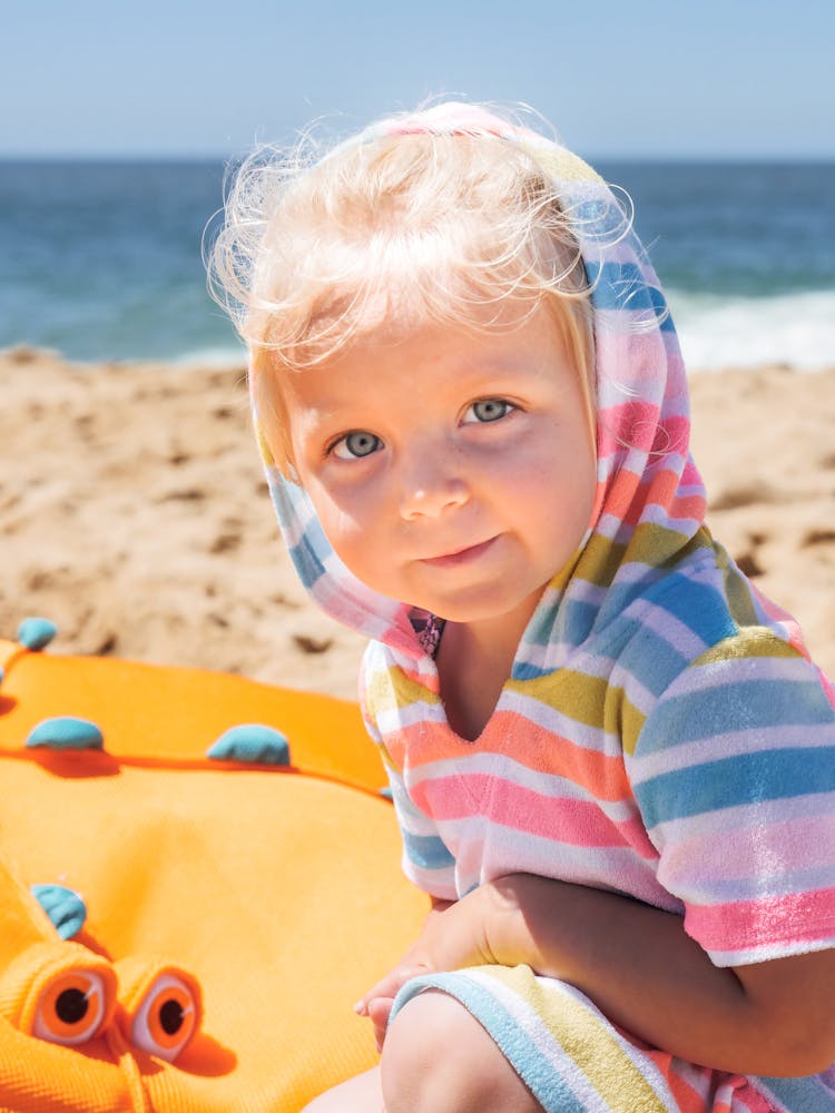 Girl Wearing A Hoodie At The Beach