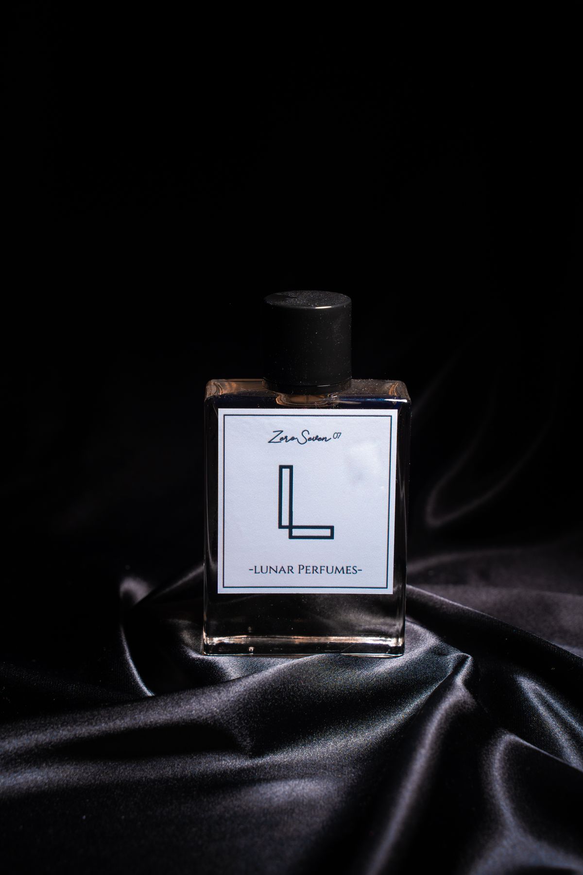 Signature attar bottle on black silk