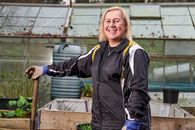Smiling Woman in Black Jacket Standing and Smiling