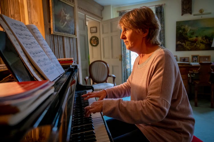 Mature Woman Playing Piano