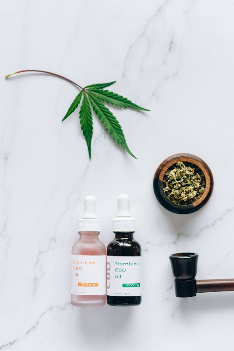 Cbd Oil Products On Marble Surface