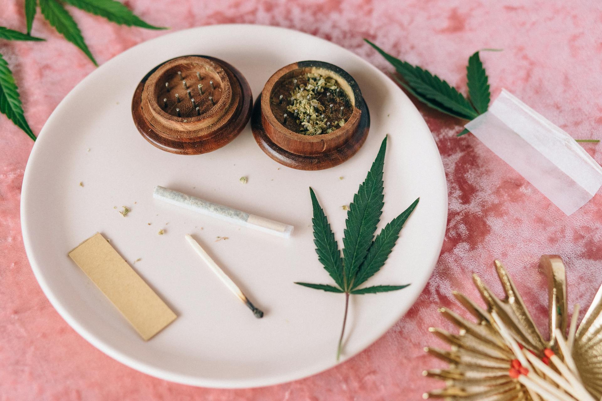 Marijuana Joint and Leaves on the Plate