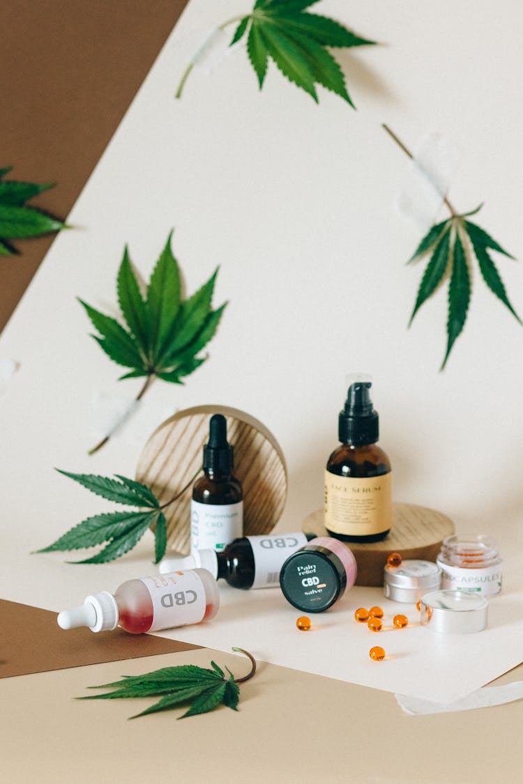 An Assortment Of CBD Products And Cannabis Leaves