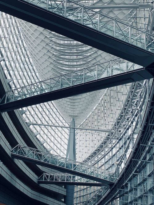 Free Intricate interior of the Tokyo International Forum highlighting modern architecture. Stock Photo