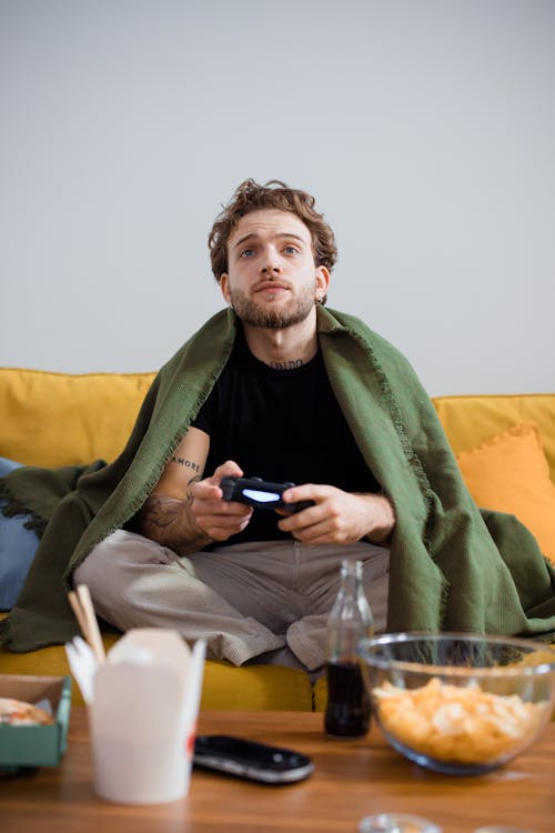 Free A Man Sitting on the Couch Stock Photo