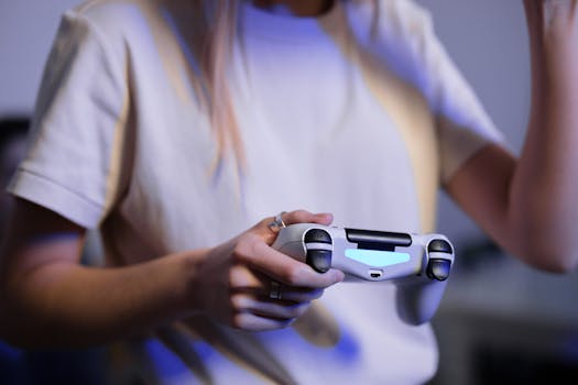 Person playing video games with game controller in a relaxed setting.