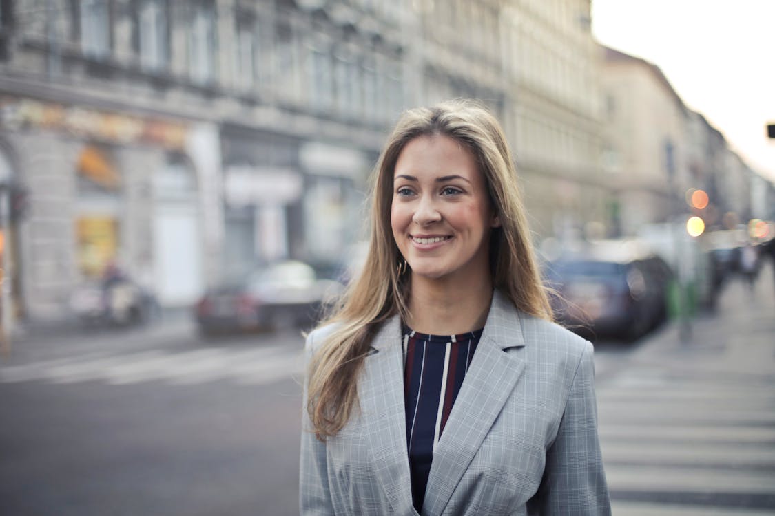 Free Close-up Photography of a Woman Wearing Formal Coat Stock Photo