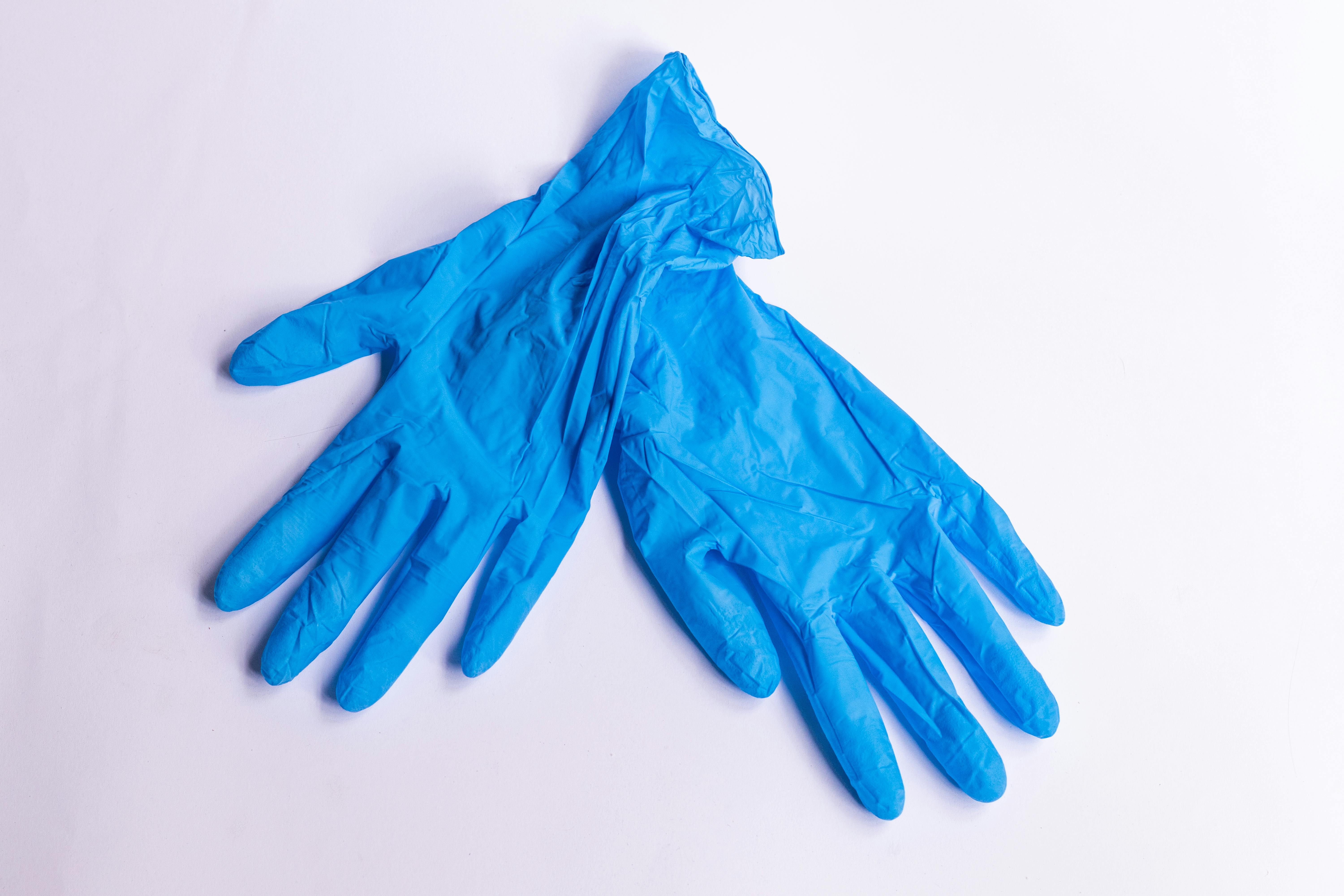 a pair of blue latex gloves