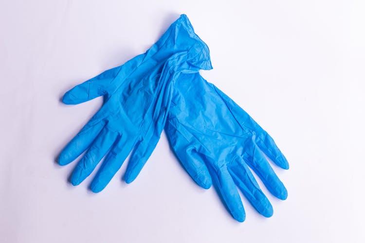 A Pair Of Blue Latex Gloves