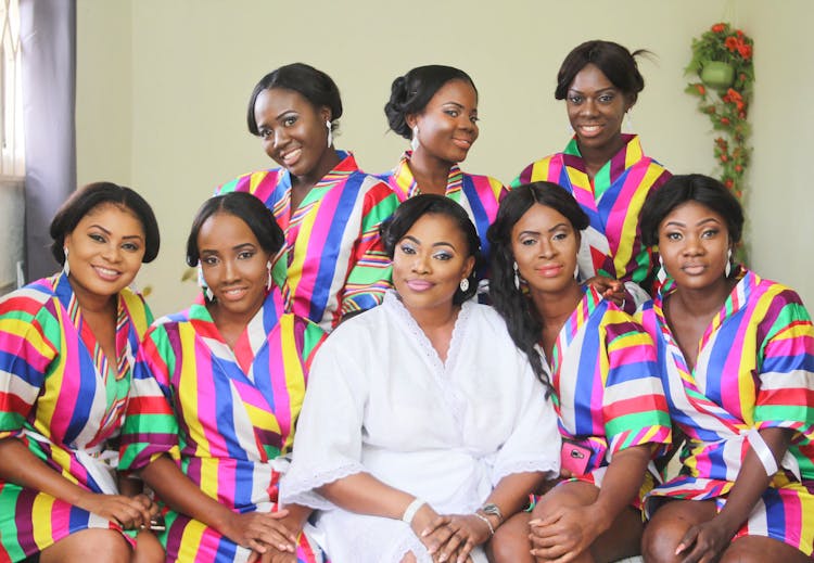 A Bride Posing With Her Entourage