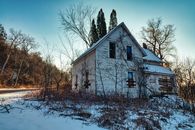 Abandoned House near Bare Trees
