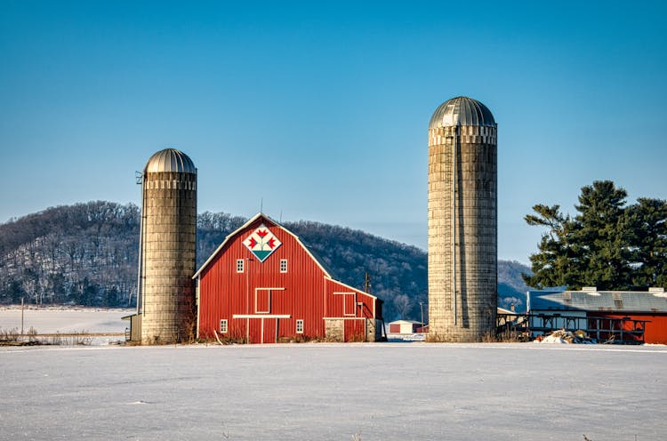 Red Barn And Silos In A Farm At Winter 