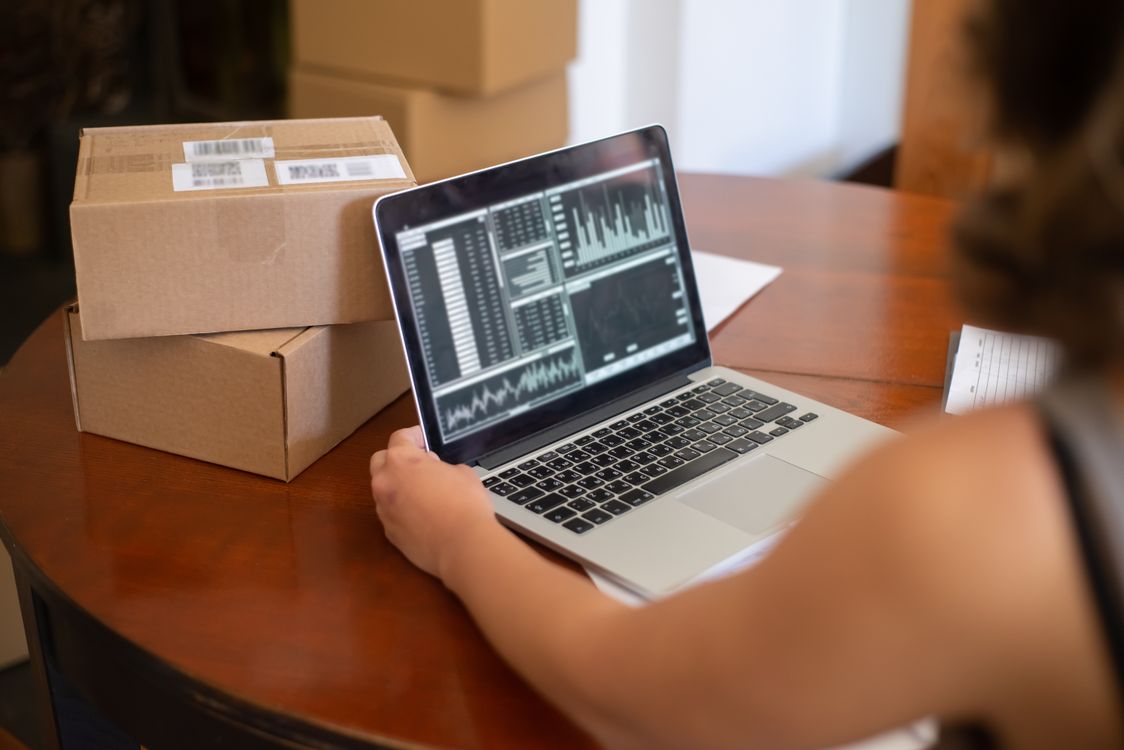 Small business owner reviewing analytics on a laptop
