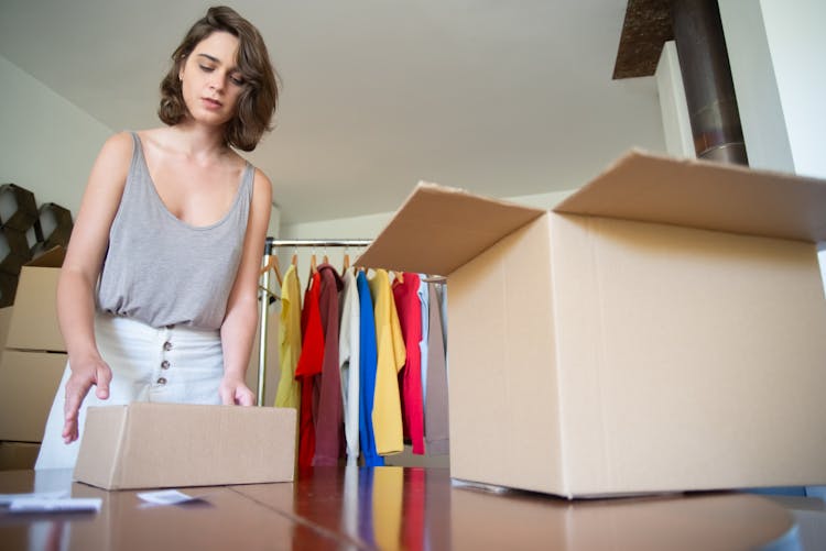 A Woman Packing Her Merchandise