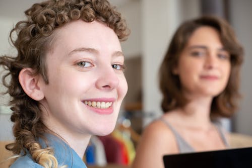 A Woman in Blue Shirt Smiling