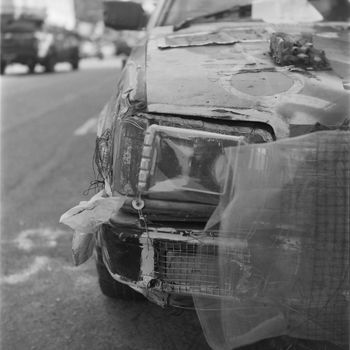 Grayscale Photo of Car Covered With Snow