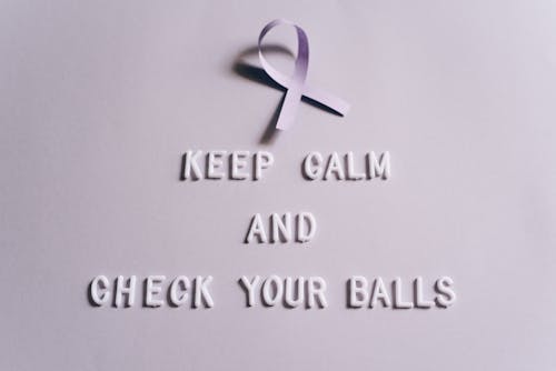 Text Saying "Keep Calm and Check Your Balls" on Light Background 