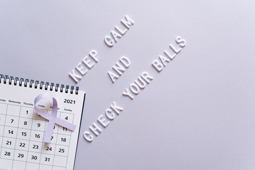 Cancer awareness concept with calendar and text reminder for self-check in minimalist style.
