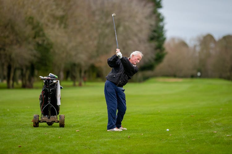 An Elderly Man Playing Golf