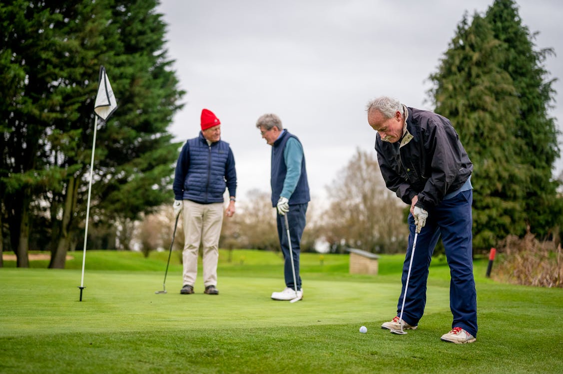 Free Elderly Men Playing Golf Stock Photo