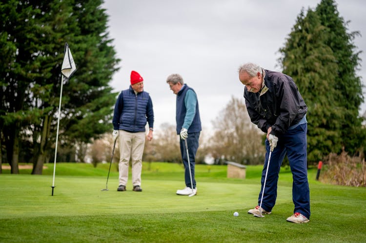 Elderly Men Playing Golf