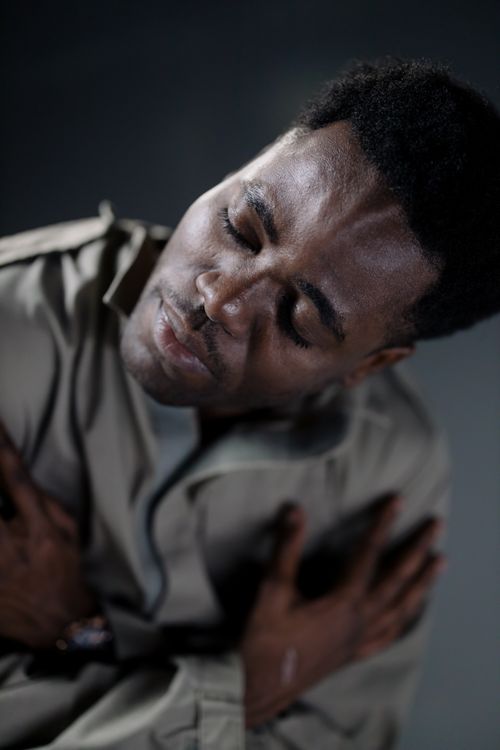 Free Close-up portrait of a man with eyes closed, capturing a moment of introspection. Stock Photo