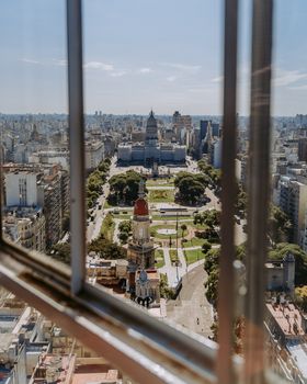 A breathtaking view of Buenos Aires showcasing city architecture and green parks under a clear sky.