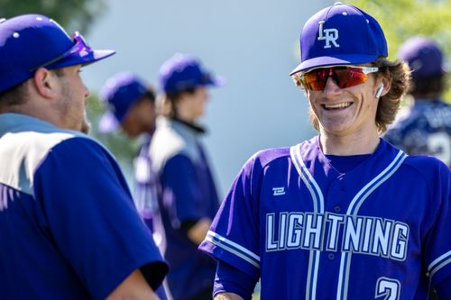 Smiling Little Leather player in a blue Lightning jersey