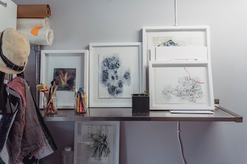 Paintings and Different Things on a Shelf