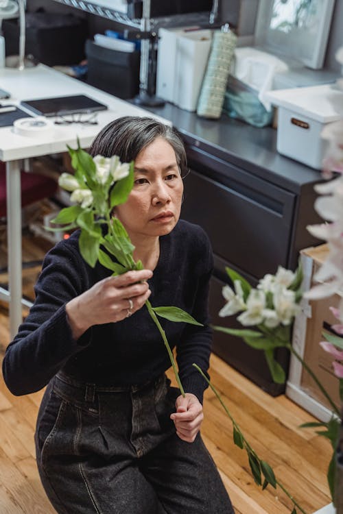 A Woman Arranging Flowers