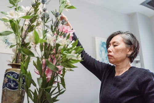 A Woman Arranging Flowers